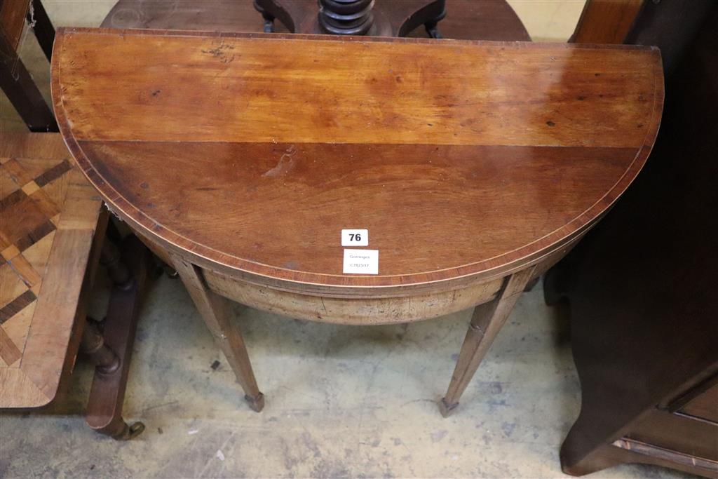 A George III inlaid mahogany D shaped folding card table, width 88cm, depth 42cm, height 75cm